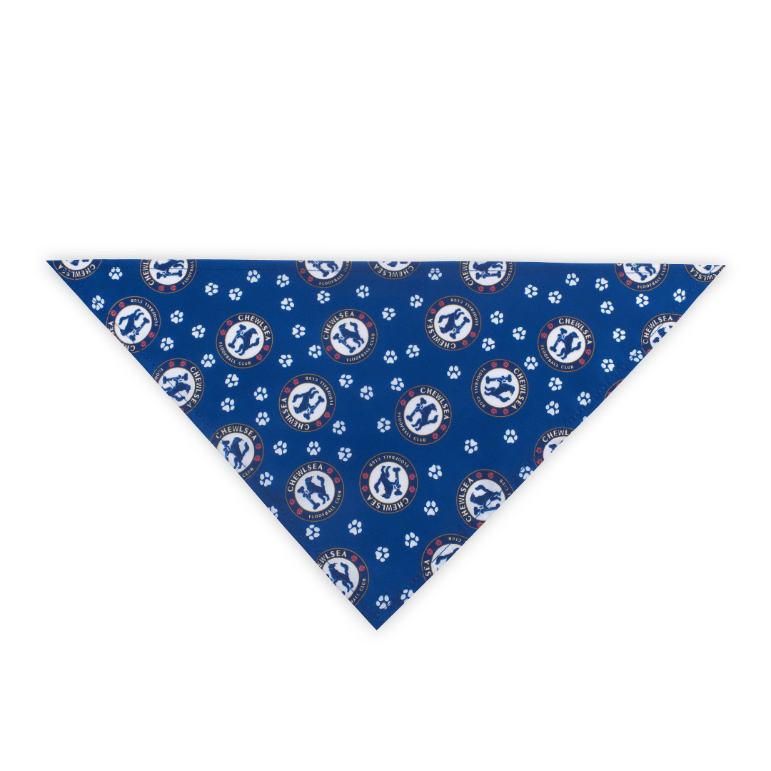 Flat-lay image of blue soccer dog bandana with Chelsea Football Club-inspired logo and paw prints on a white background