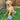 A plush soccer ball dog toy placed on the grass next to a golden retriever dog.
