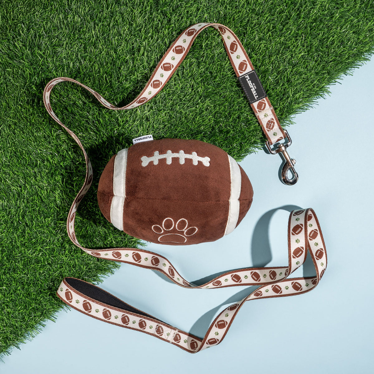 Floofball football dog collection featuring a plush football dog toy and coordinating football print dog leashes.