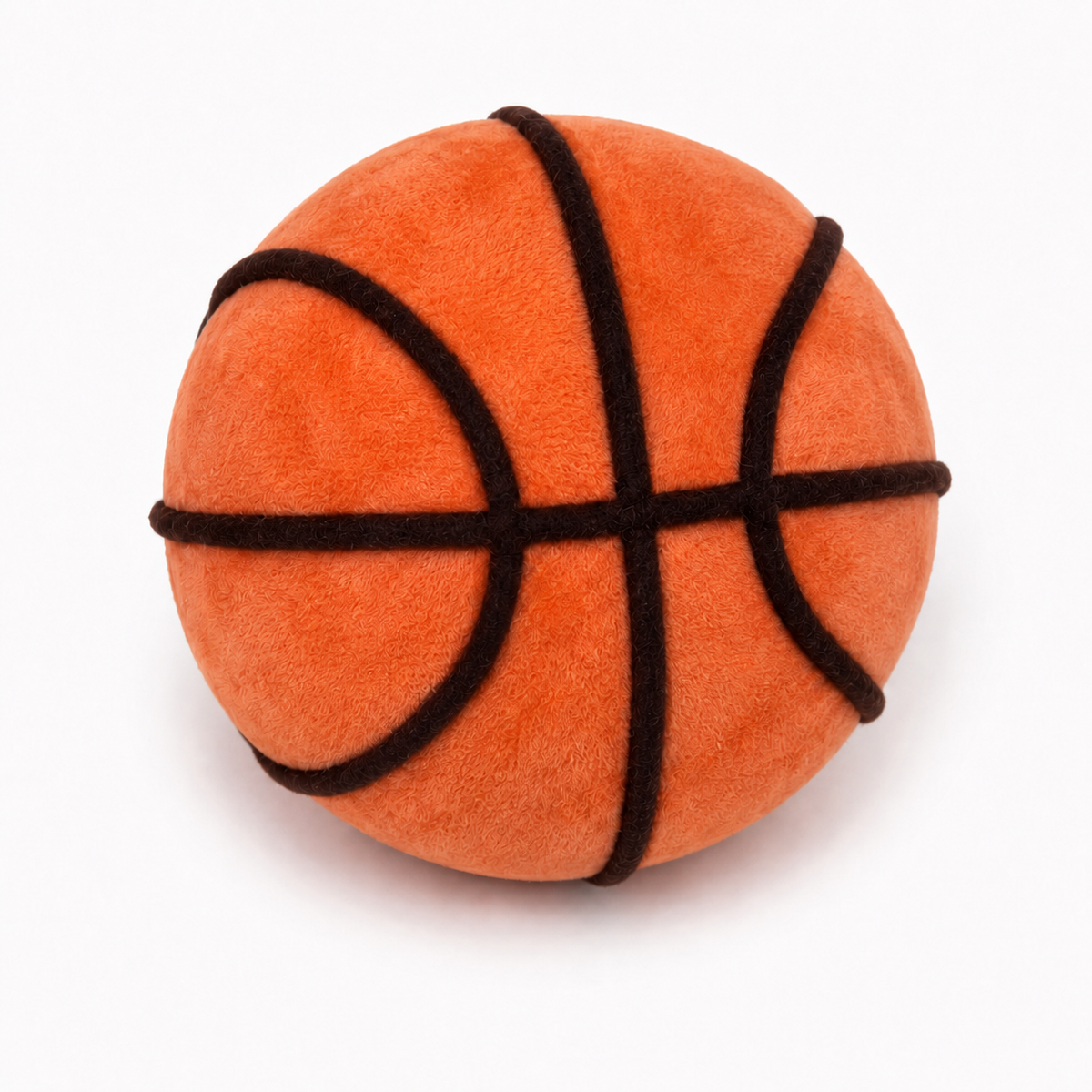 Angled view of the Floofball plush basketball dog toy showing its orange fleece exterior and black basketball seam detailing.