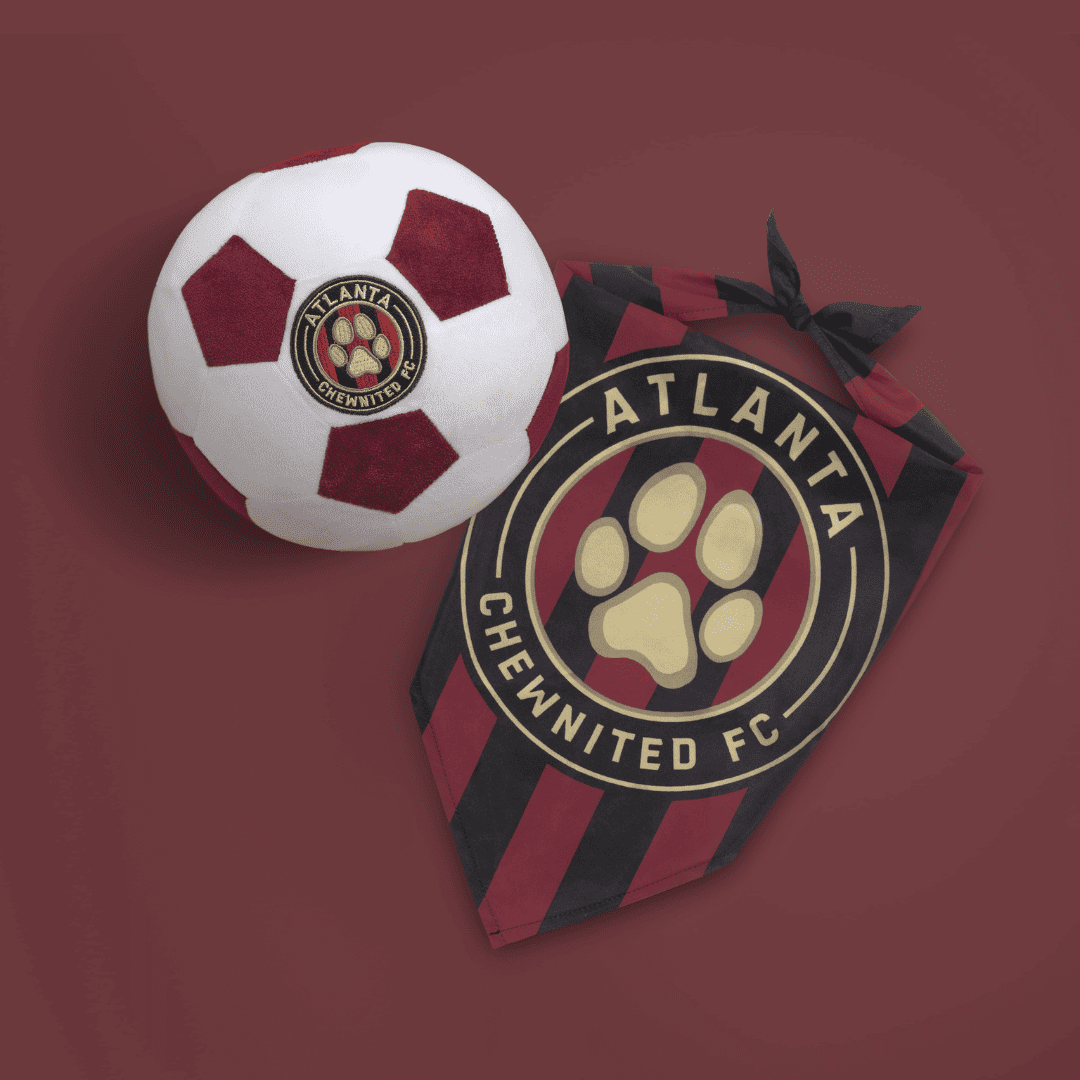 Lifestyle image Atlanta parody dog bandana featuring a stylish soccer-inspired design and plush soccer ball dog toy, perfect for sporty pups and unique soccer gifts for dog-loving soccer fans